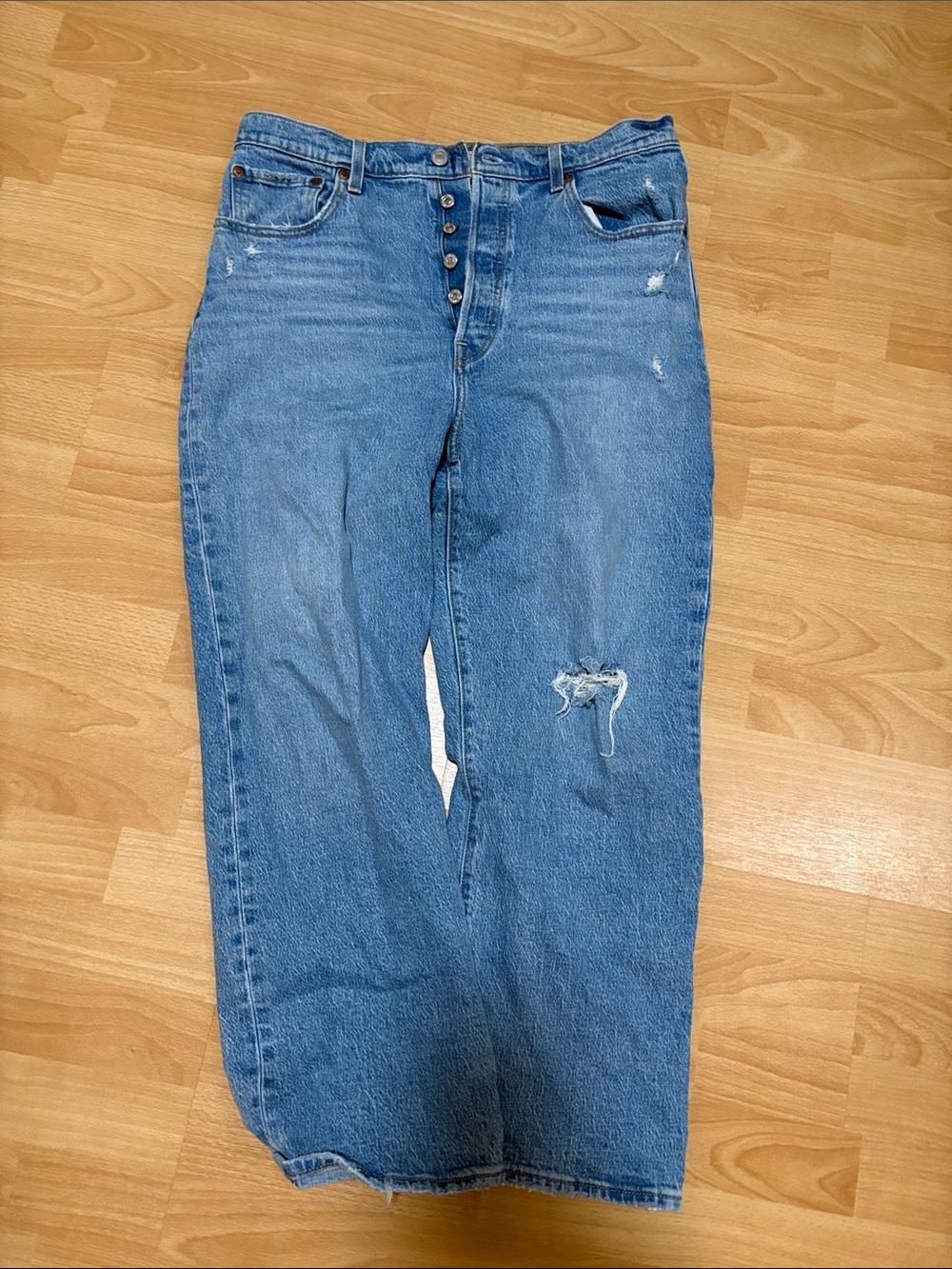 Levi's Women's Boyfriend Jeans in Light Blue with Distressed Detail
